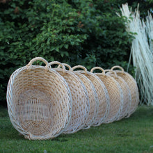 Load image into Gallery viewer, Line of washing baskets with peeled willow in the background 