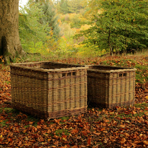 Handmade in UK natural log baskets in woodland setting